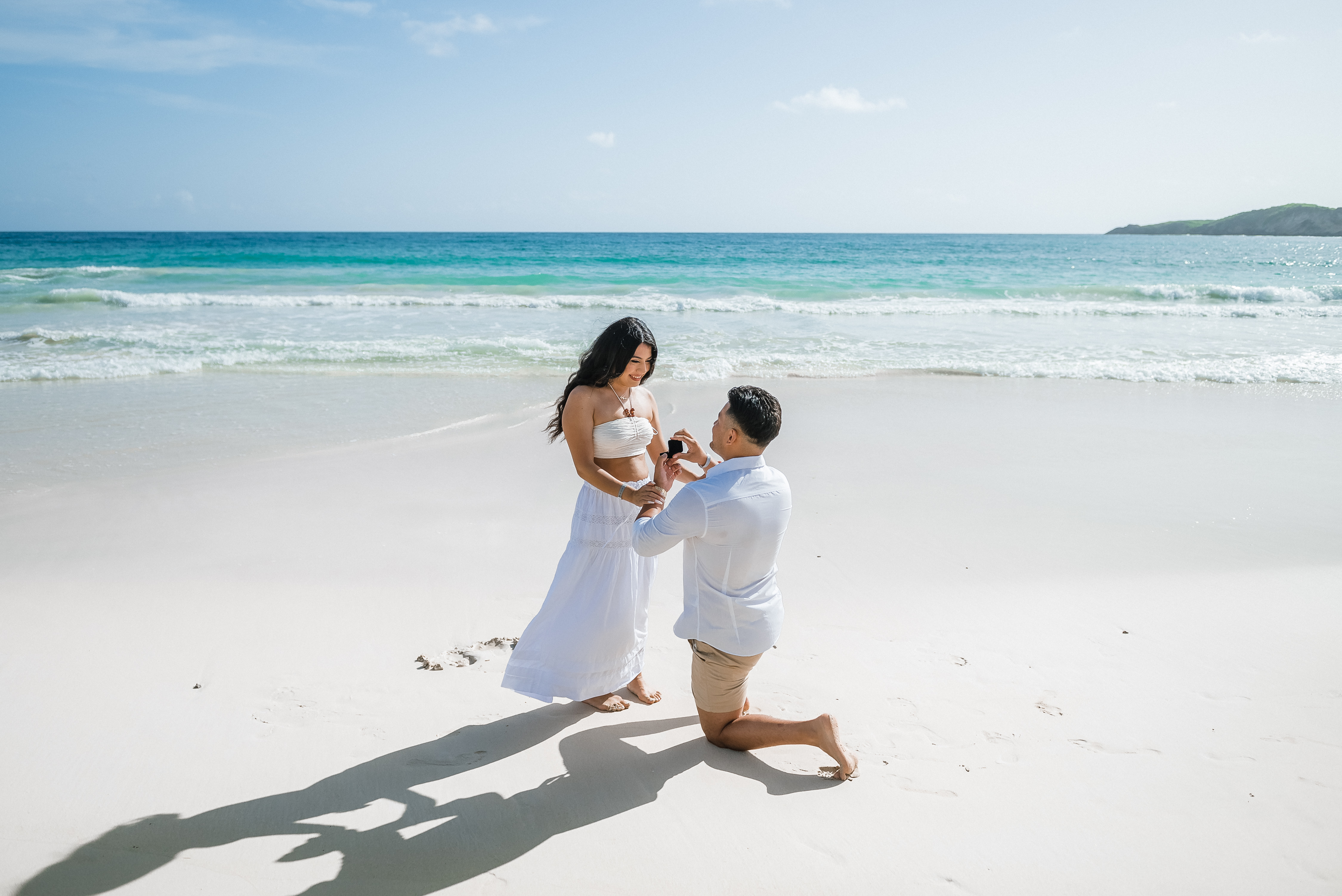 Hero photograph of the couple at sunset — replace with your hero image